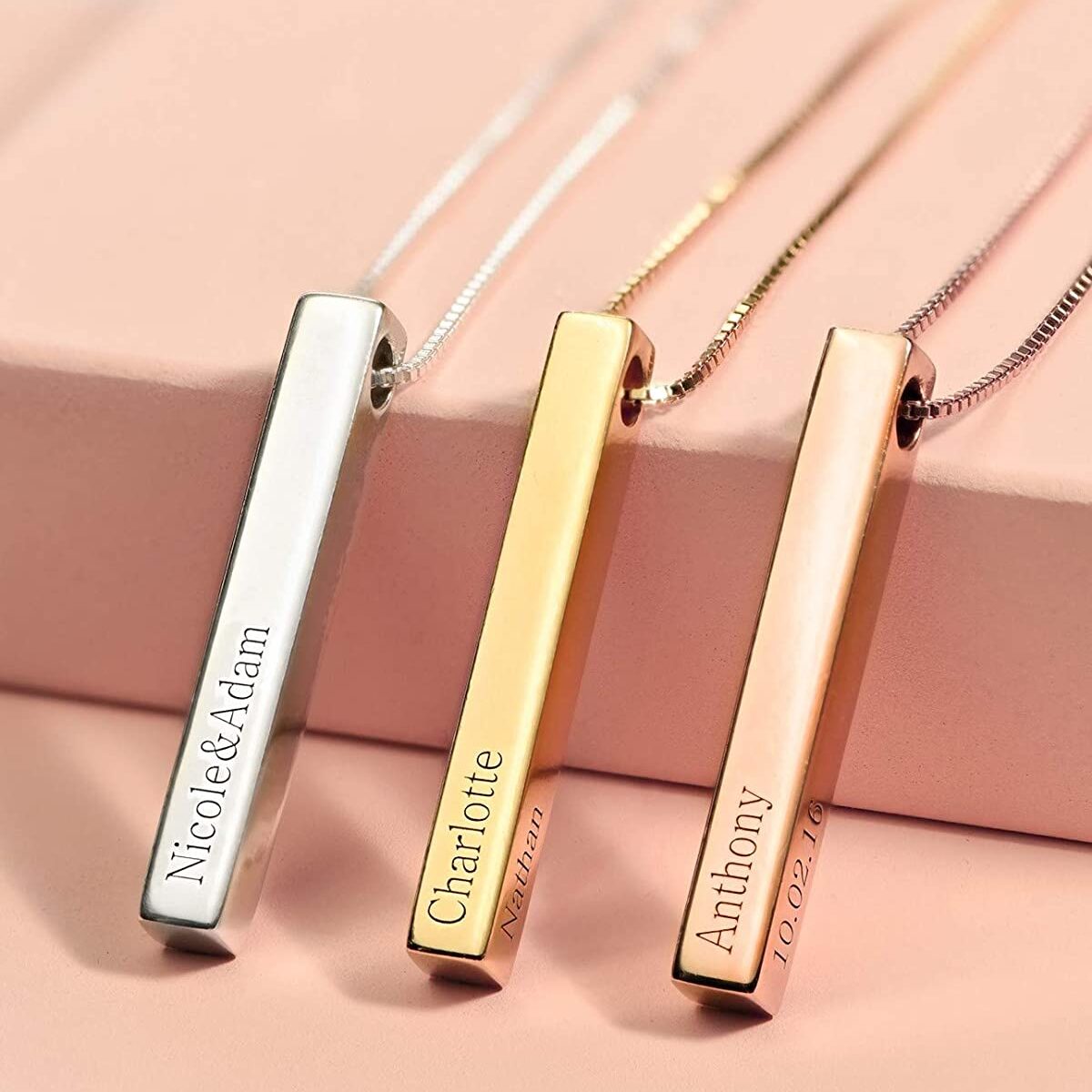 Three Ankx.in personalised jewellery pieces, engraved bar necklaces in silver, gold, and rose gold