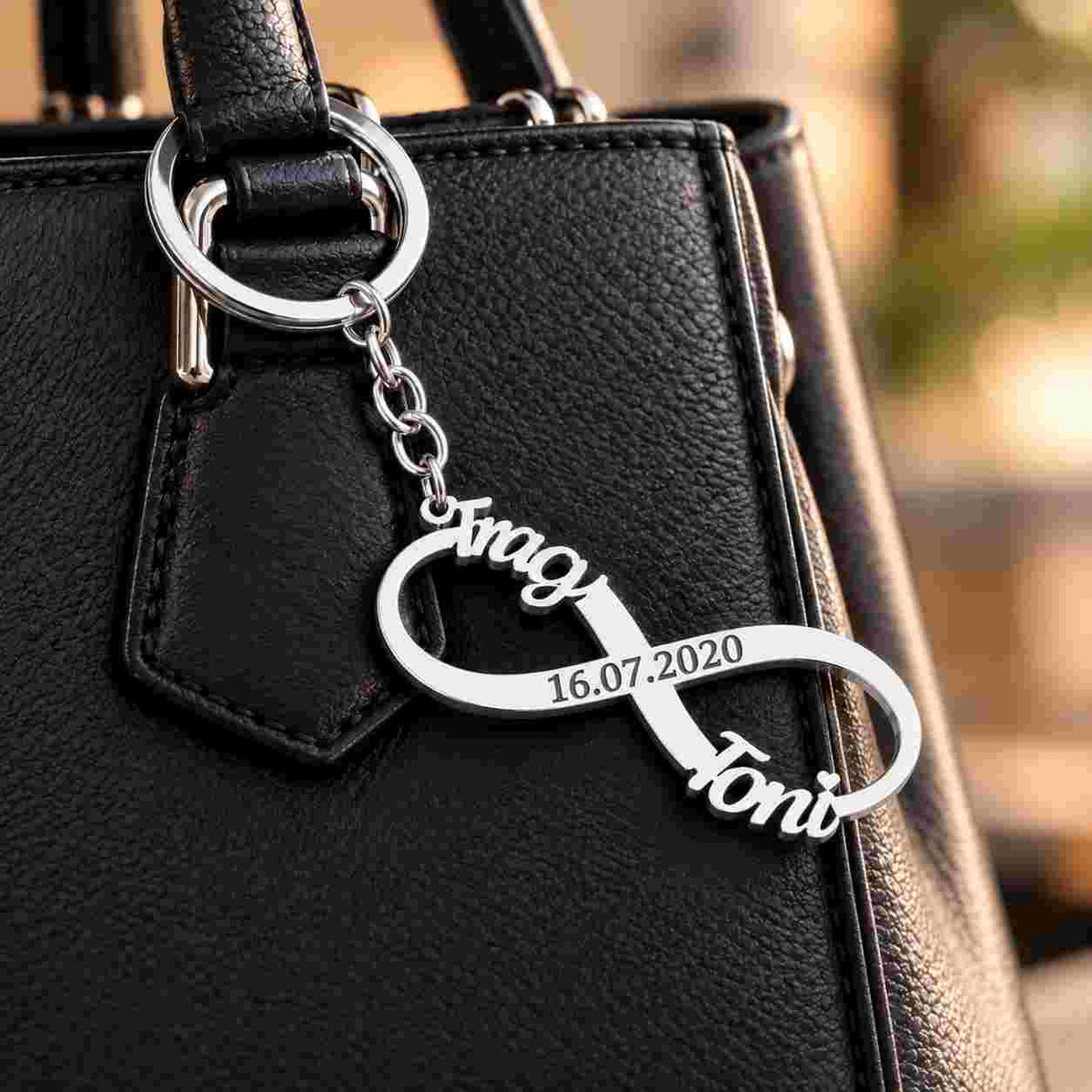 Personalized Couple Keychain with Infinity Design, Silver Finish, featuring names 'Toni' and date '16.07.2020'