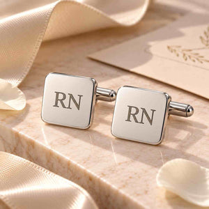 Personalized Silver Square Cufflinks for Mens with Initials RN on a Marble Surface