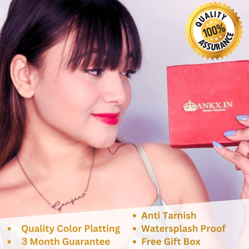Custom Couple Name Necklace With Heart worn by woman with red lipstick holding a red Ankx.in gift box