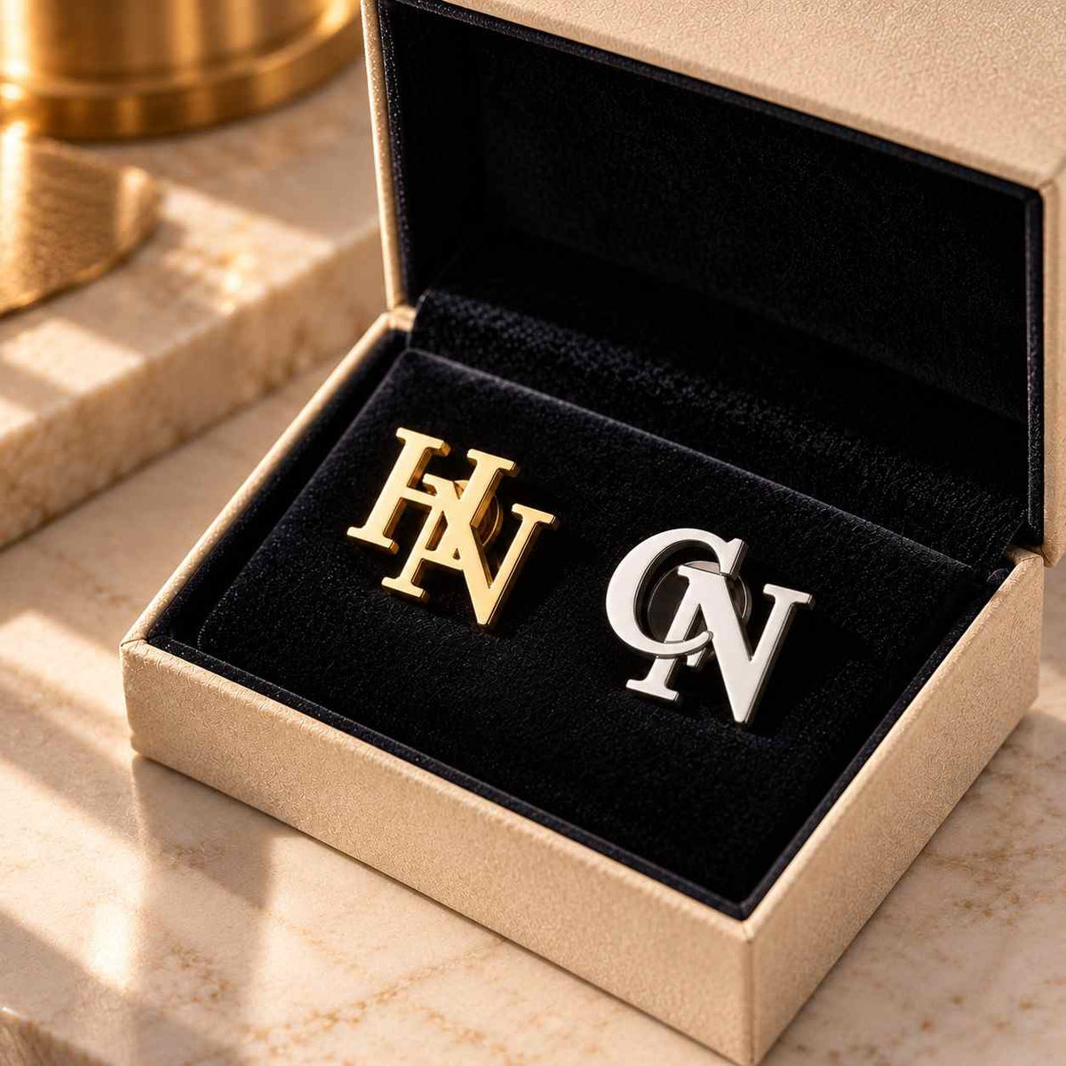 Custom Initial Lapel Pin set in gold and silver with personalized initials HN and CN in elegant box