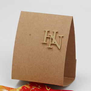 Custom Initials Brooch displayed on a stylish cardboard packaging for personalized gifting