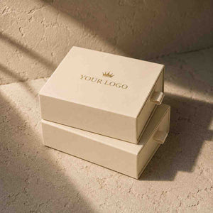 Elegant custom jewelry boxes in cream color featuring a logo design for branding purposes