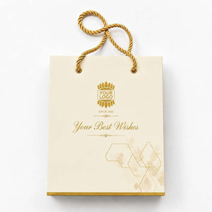 Elegant cream paper carry bag with golden logo and decorative design for gifts or branding