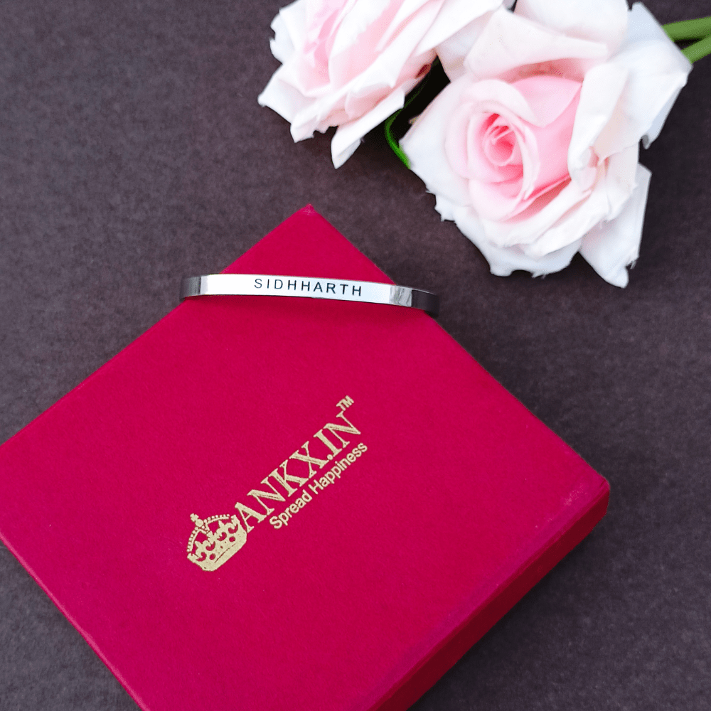 Customized gift jewelry online India, featuring a personalized bracelet with the name SIDHARTH and elegant packaging