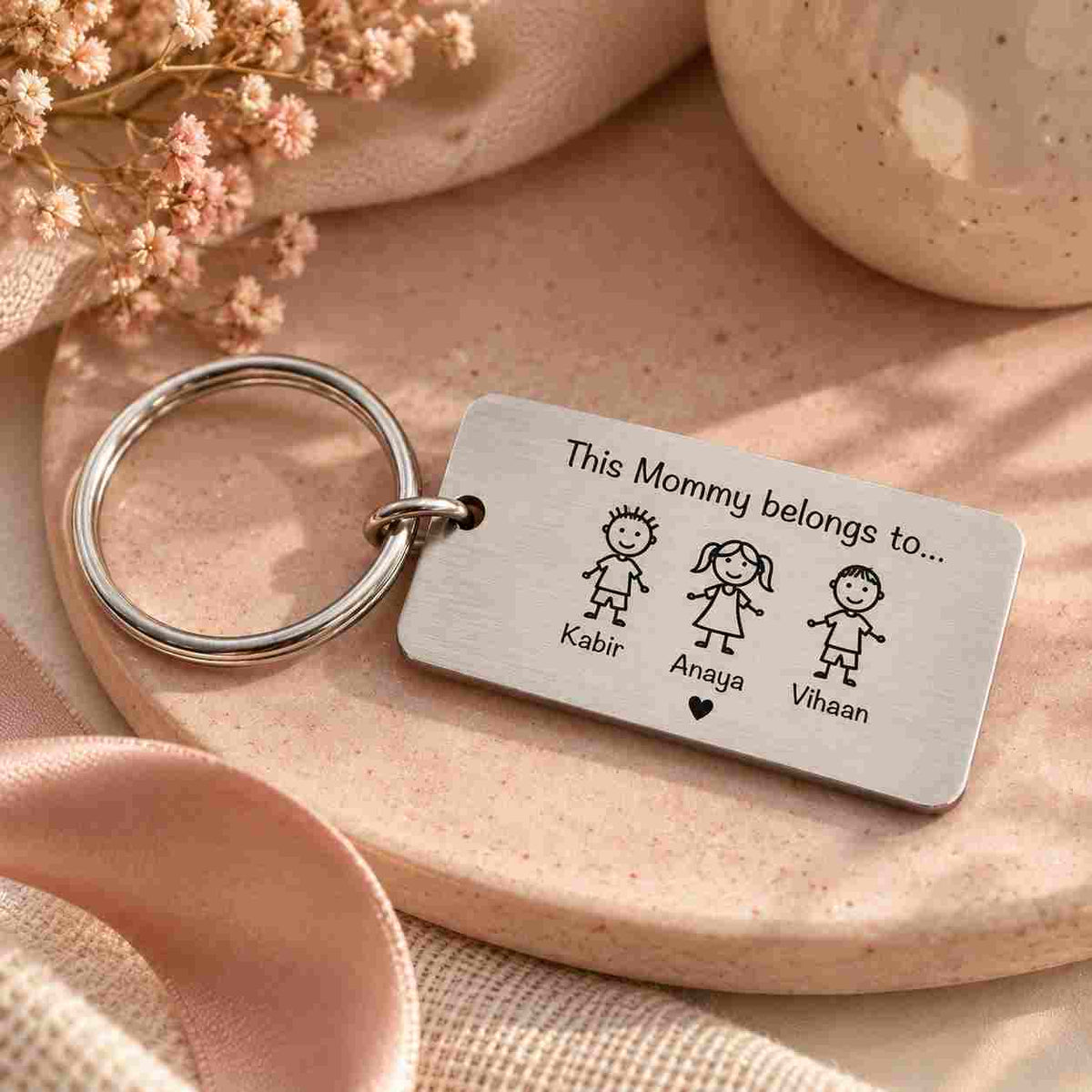 A silver metal keychain with a rectangular engraved tag and key ring customised message by ankx order