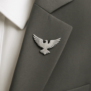 Stylish silver bird brooch on men’s blazer – luxury lapel pin for formal outfits