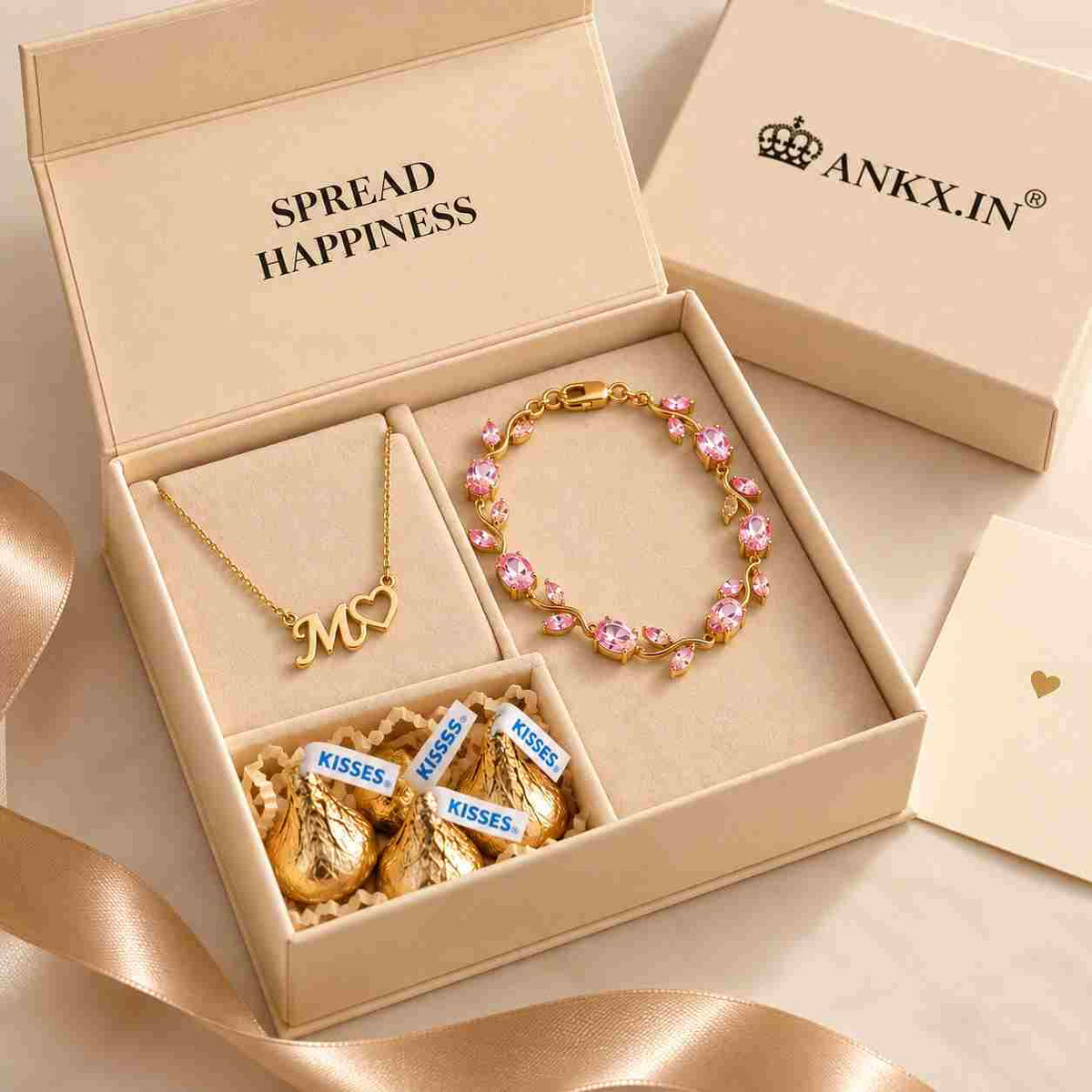 Ankx.in Gift Combo for Her featuring a personalized gold necklace with initials and a pink floral bracelet