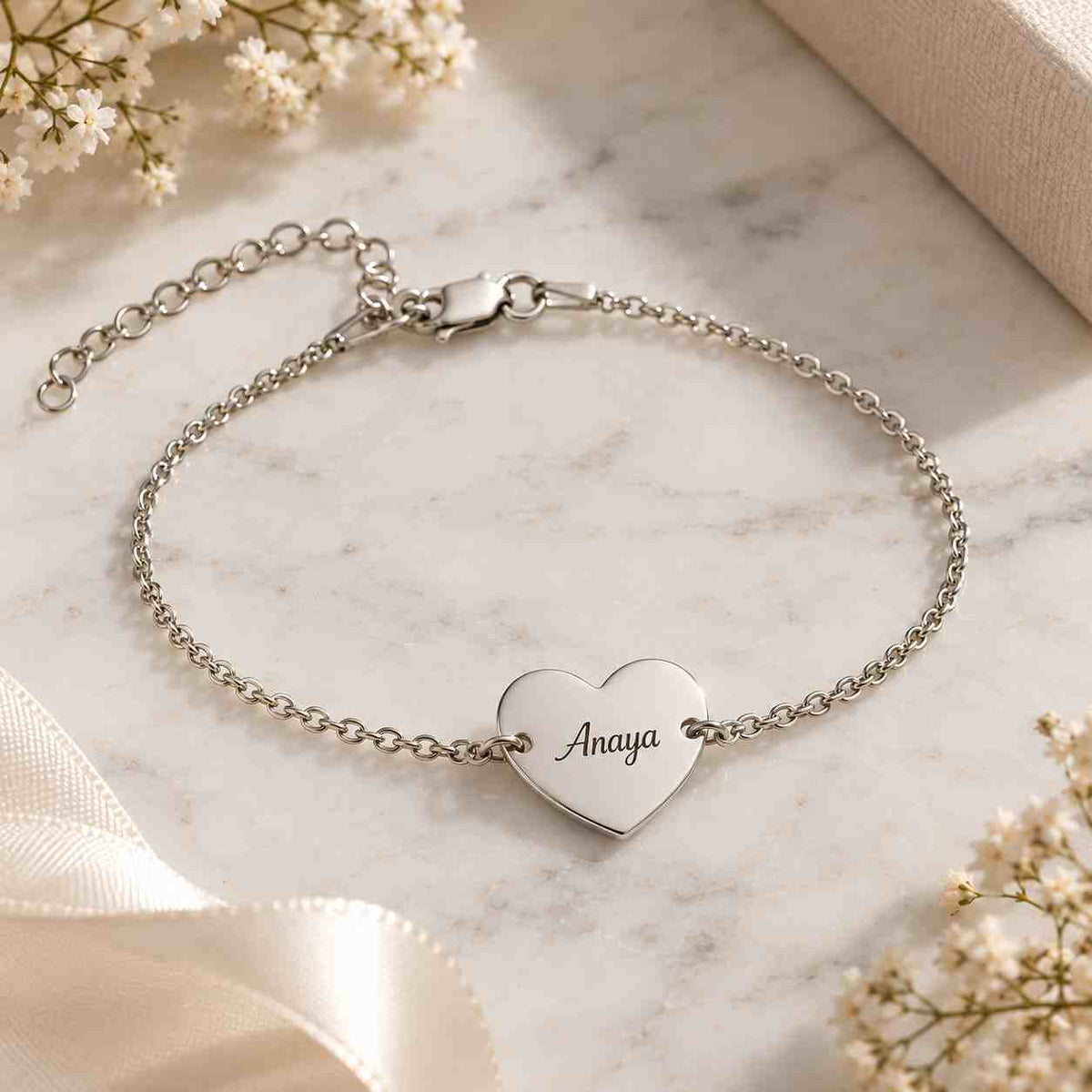 Gold heart name bracelet in a gift box featuring a beautiful couple design