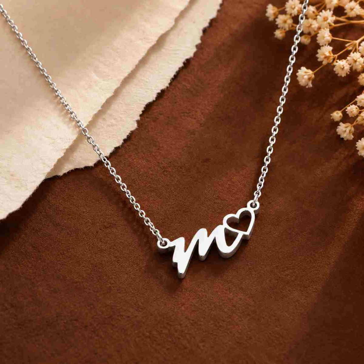 Personalized Silver Initial Necklace for Her featuring a stylish 'm' with a heart charm