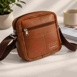 Brown leather sling bag with custom logo on white background