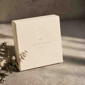 Elegant ivory luxury gift boxes featuring a customizable logo for special occasions and branding