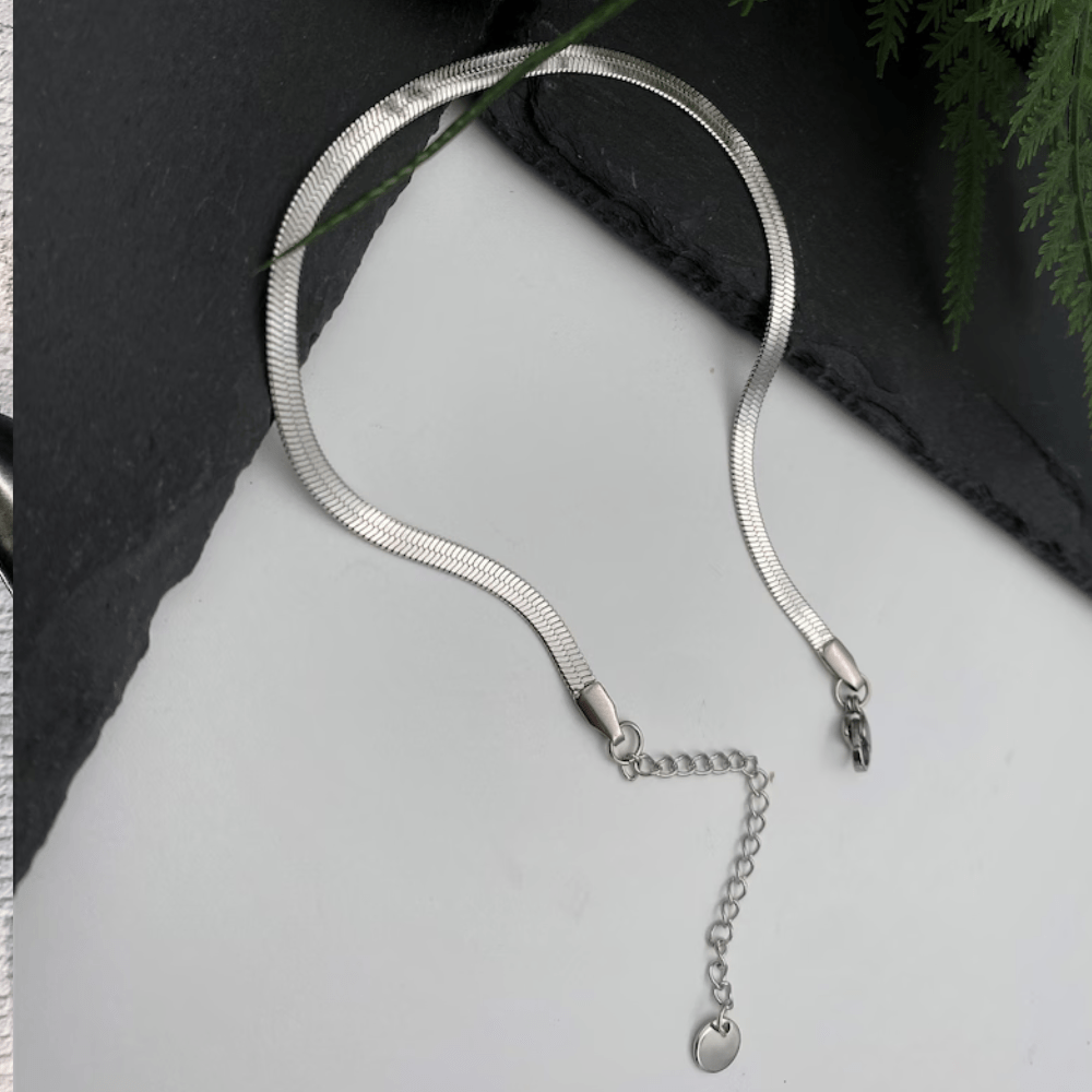 Minimal silver anklet for women with adjustable chain and heart charm detail