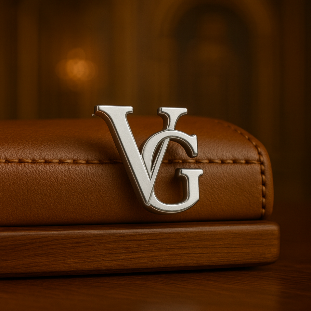 Elegant silver name brooch for men featuring the initials VG on a stylish leather background