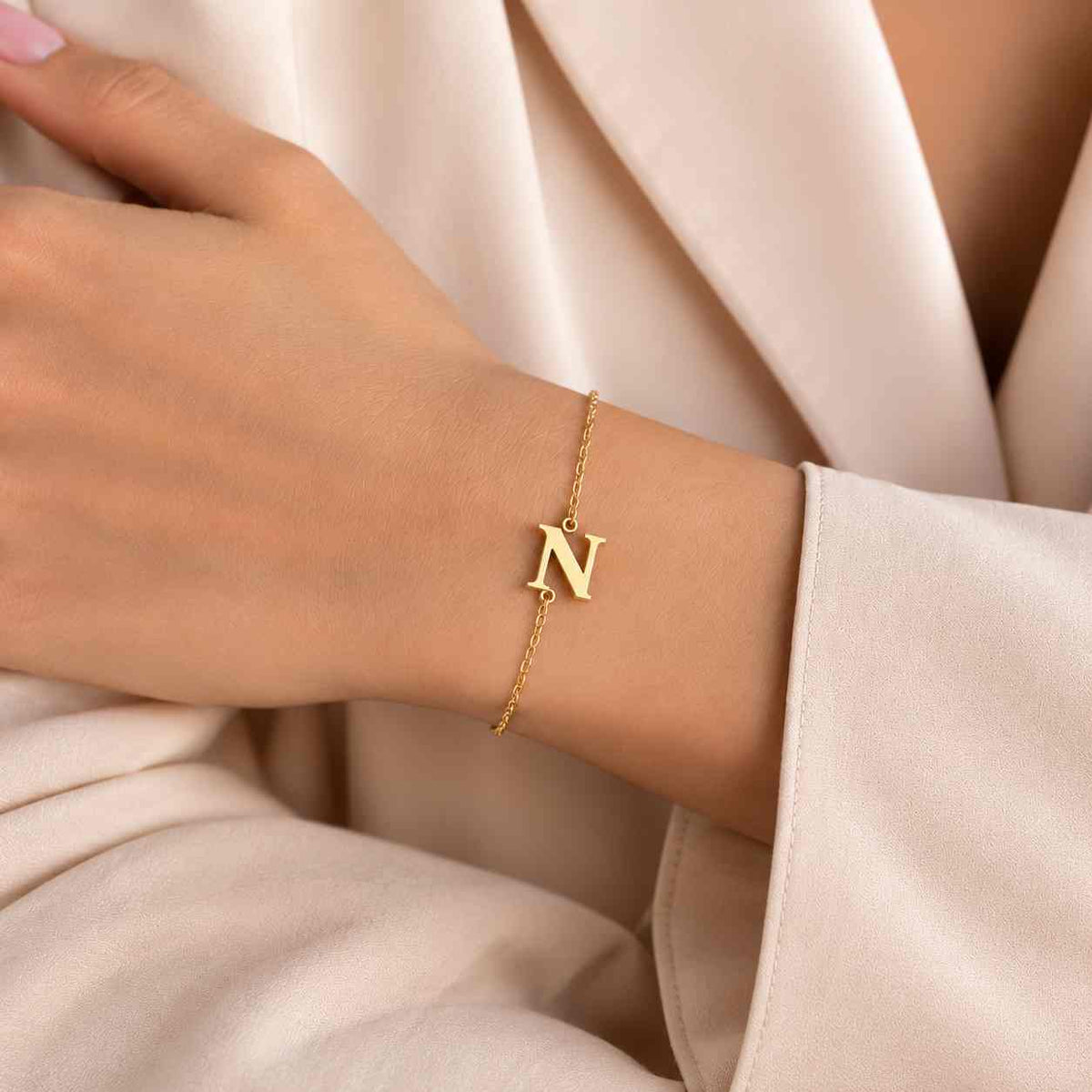 Gold Personalised Bracelet featuring initial 'N' in a delicate chain design
