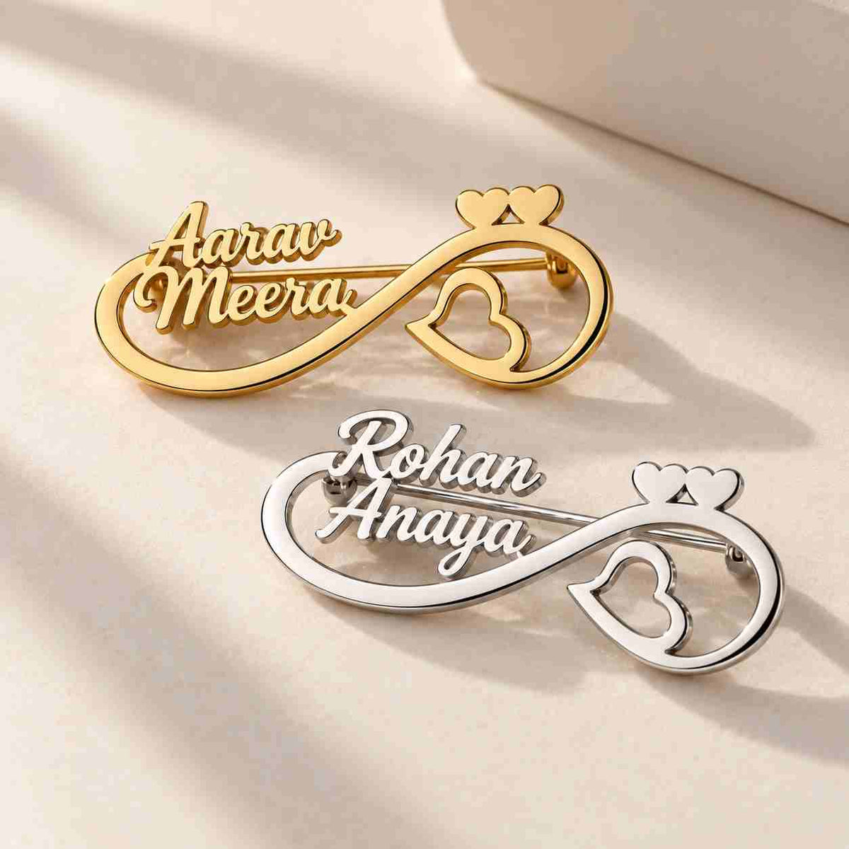 Personalised Couple Name Brooch in gold and silver with infinity design and heart accents
