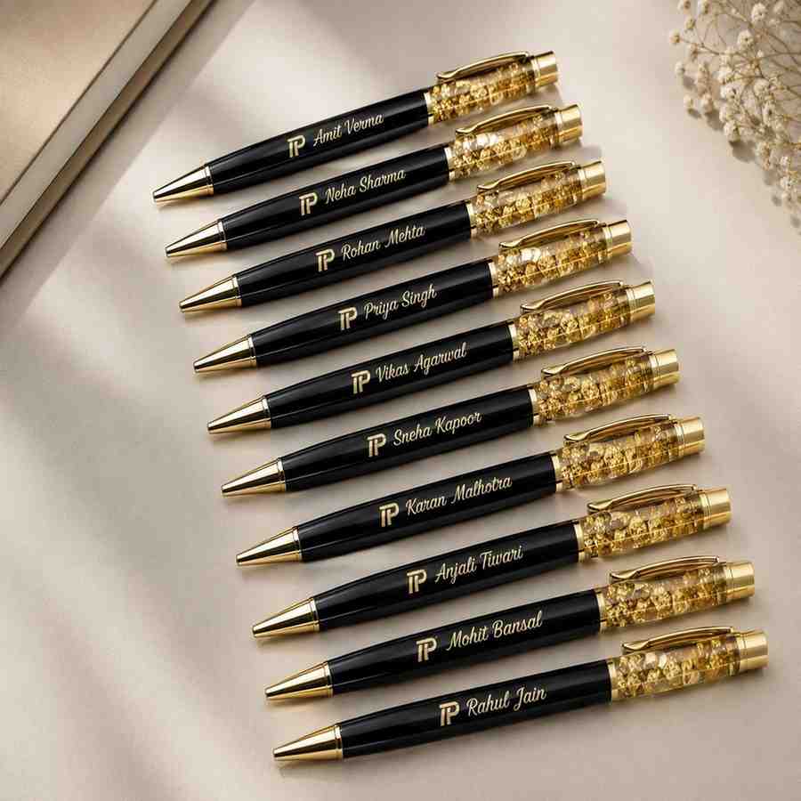 Set of personalized black and gold crystal pens engraved with different custom names for bulk corporate gifting