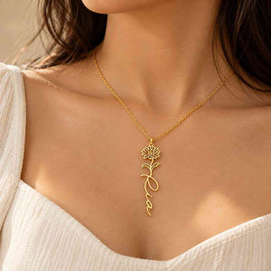 Personalized Flower Name Necklace in gold with a floral design and custom name 'Ria'.
