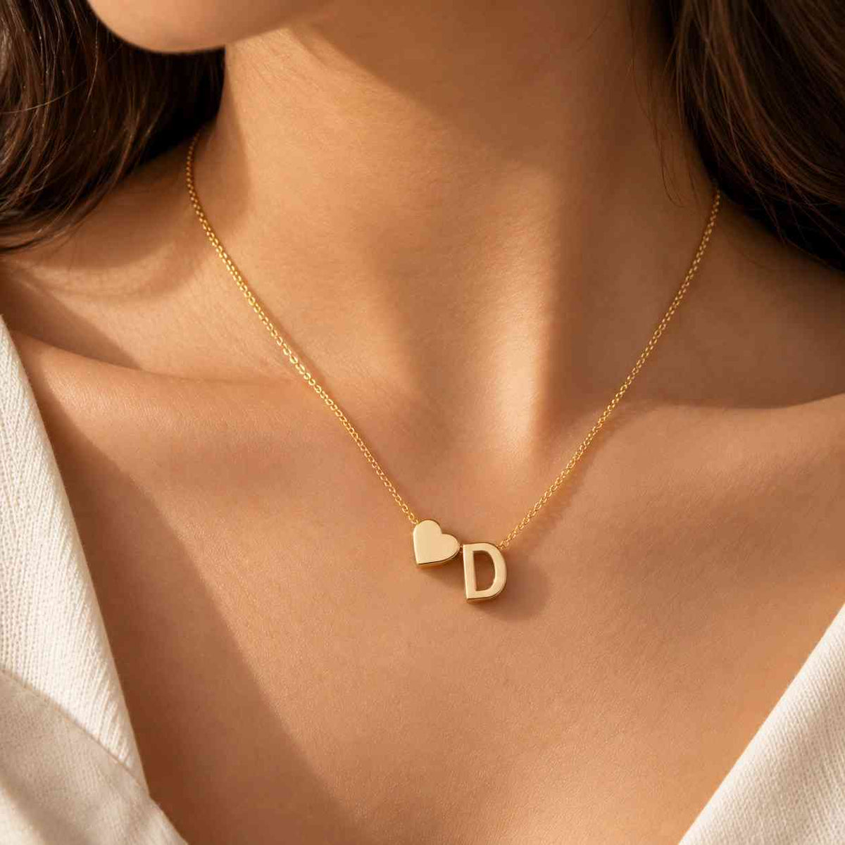 Personalized Heart Initial Necklace in gold featuring the letter D with a delicate chain