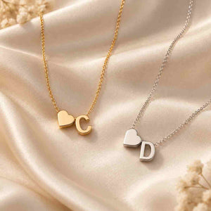 Personalized Heart Initial Necklace in gold and silver featuring initials C and D on delicate chains