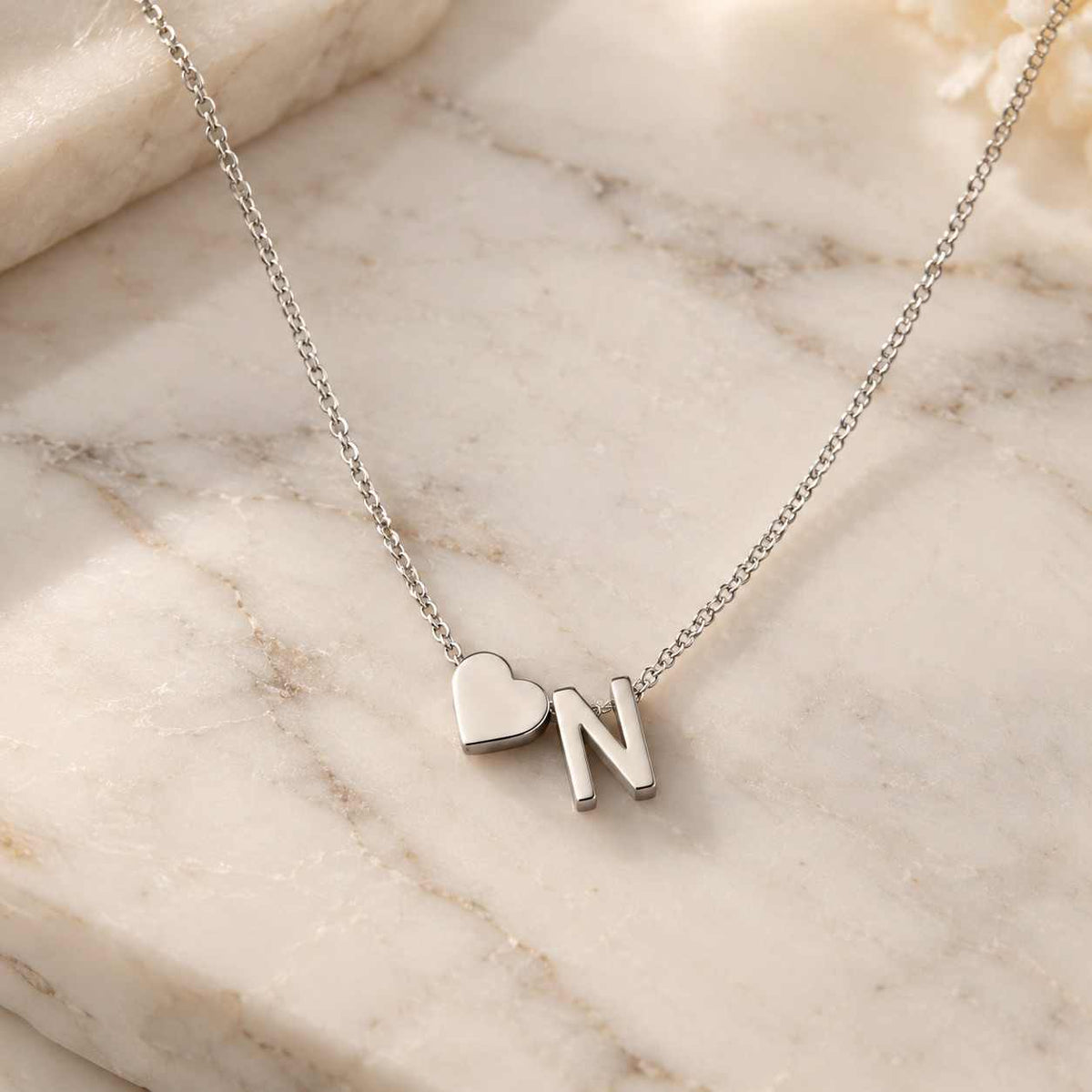 Personalized Heart Initial Necklace with silver finish featuring heart and N initial on a delicate chain