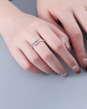 Elegant Silver hug ring showcased on a model's hand with stylish nail art
