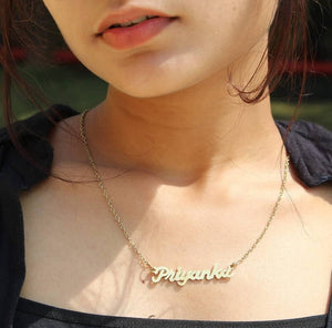 Ankx.in gold tone Simple Name Necklace with the name Priyanka worn on a woman neck