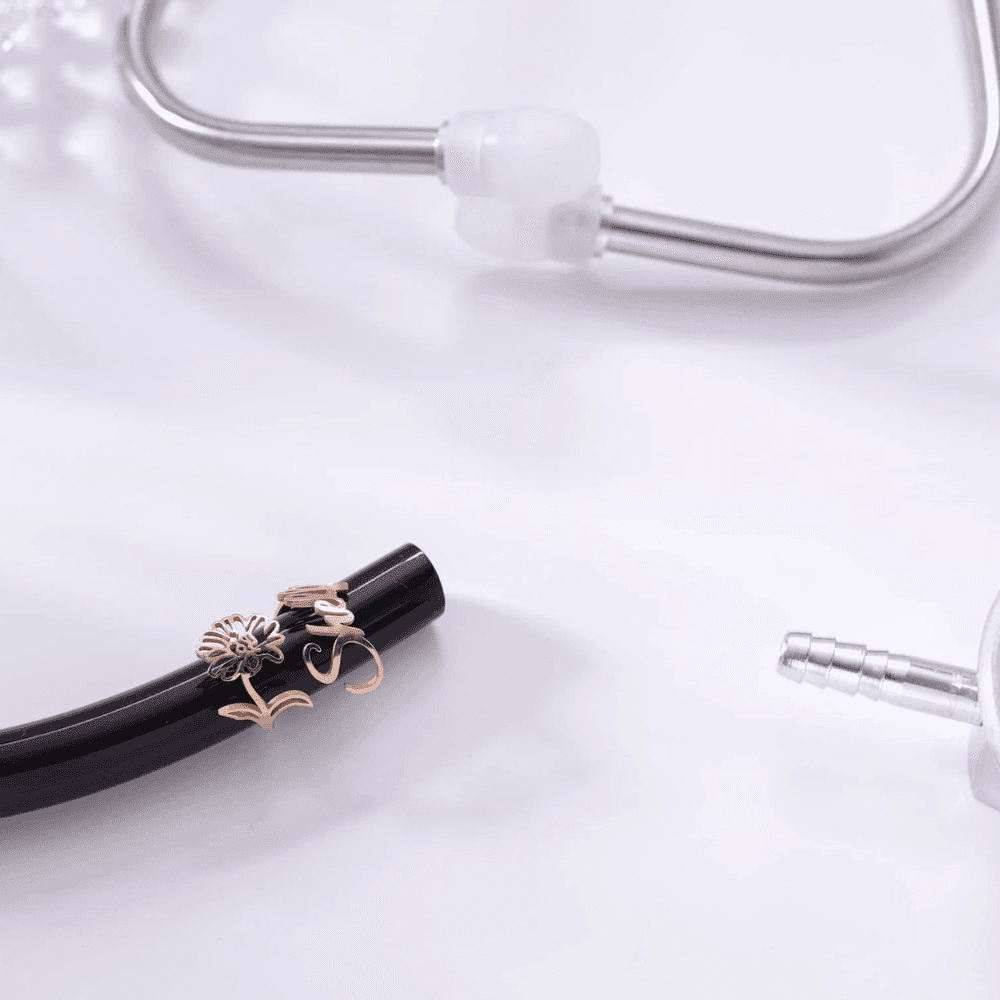 Personalized stethoscope name tag in rose gold with floral design, perfect for medical professionals