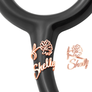 Personalized stethoscope name tag with floral design featuring the name Shelley in rose gold color